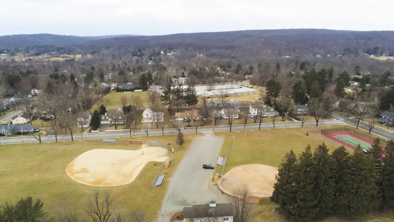 aerial photo showing Burrow Park baseball diamonds, tennis courts, and surrounding Mendham neighborhood