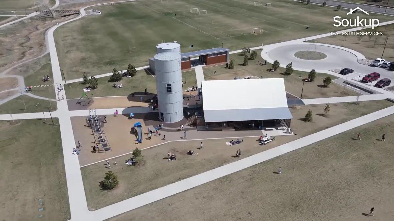 Aerial view of a Fort Collins park with outdoor activity areas, pavilion, and open space