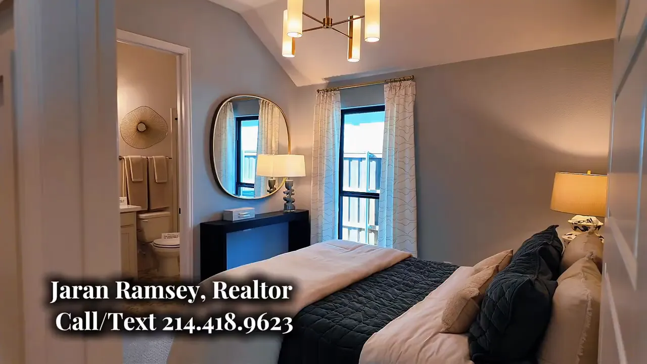 Guest suite bedroom in Meraki by Perry Homes with natural light and private bath access