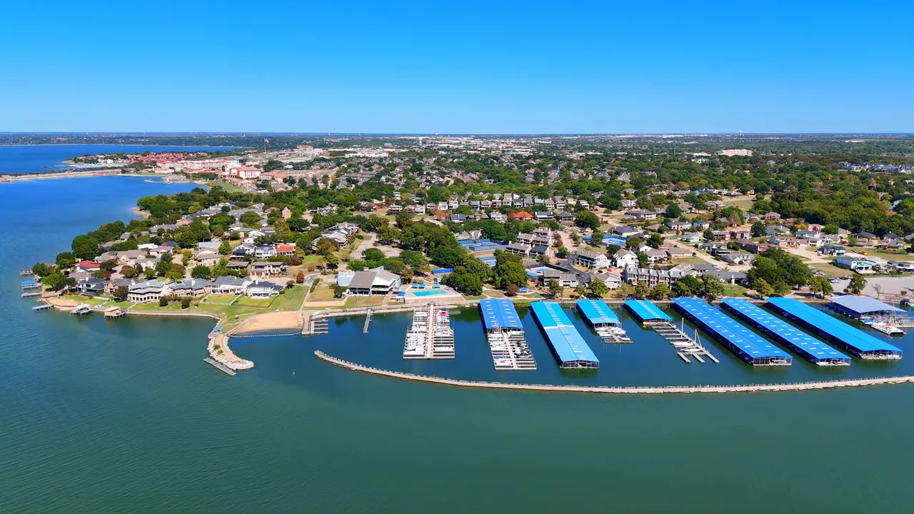 Aerial view of Heath Golf and Yacht Club marina and surrounding homes near Lake Ray Hubbard