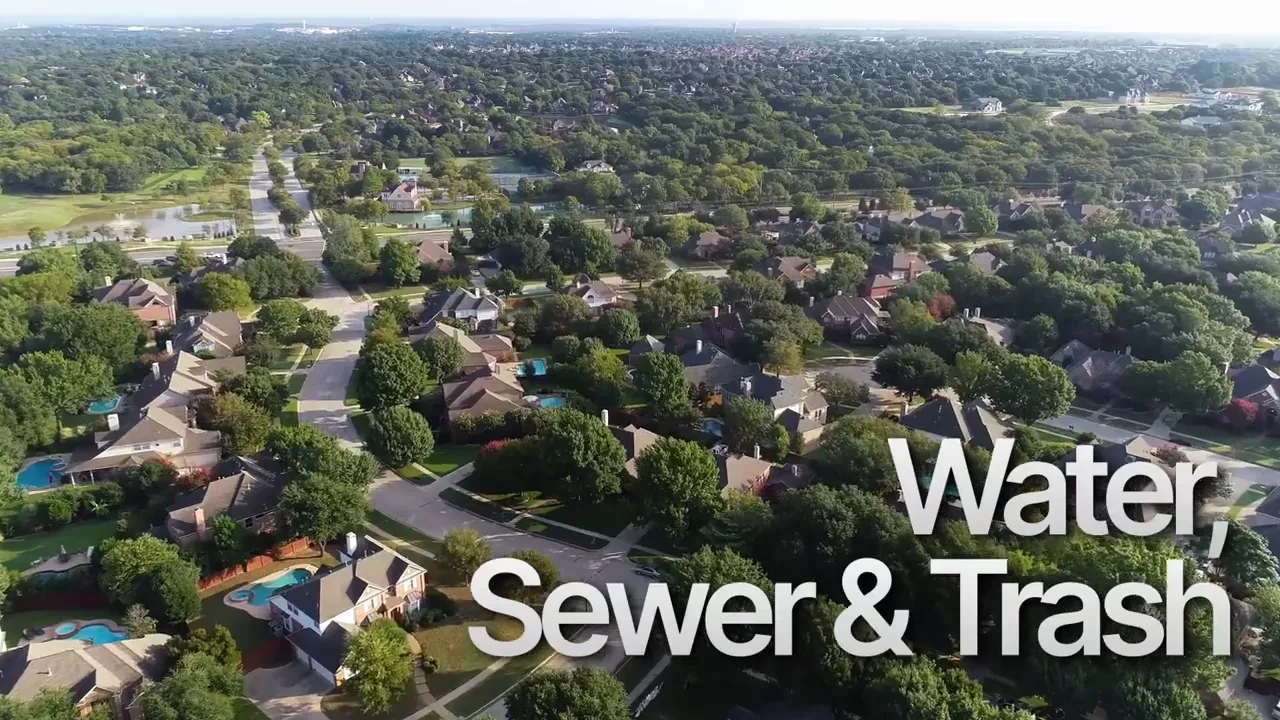 Aerial view of Central Texas neighborhoods highlighting sewer and trash utility costs