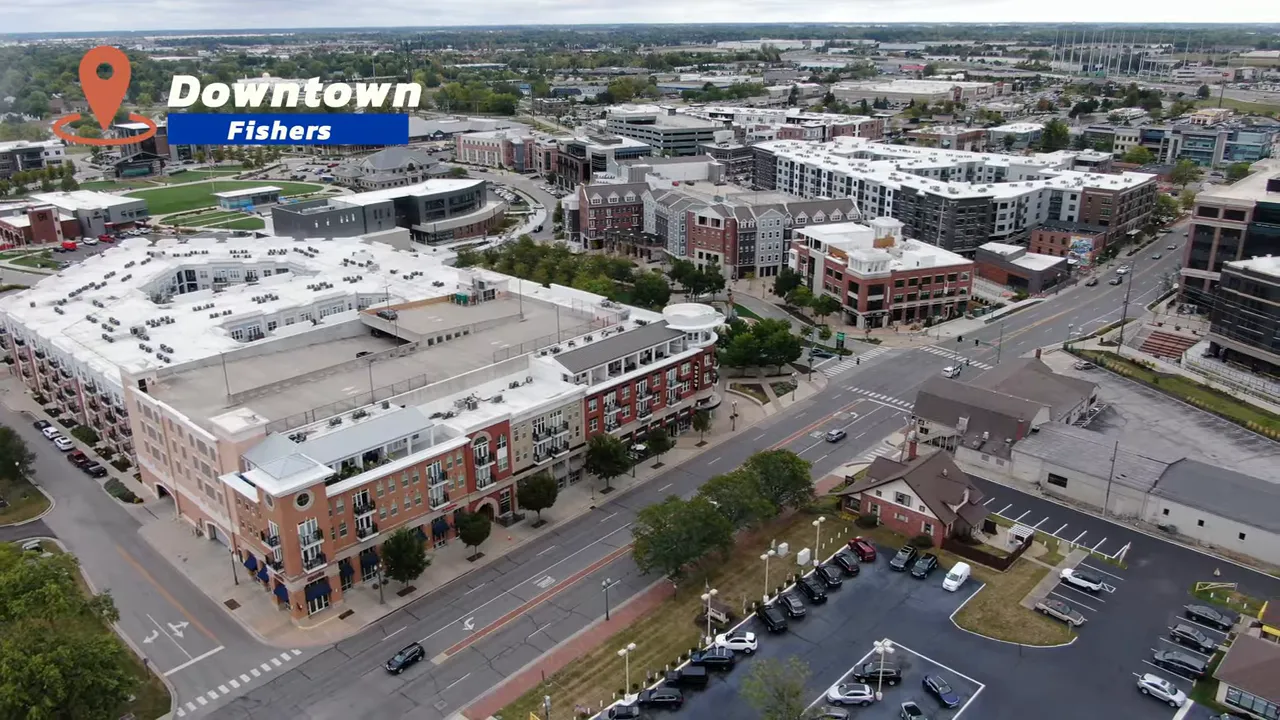 Aerial view of downtown Fishers with dense mixed-use buildings and streets