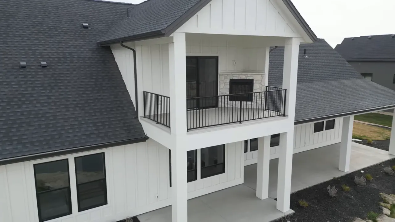 Covered upper balcony with railing on new construction home in Middleton, Idaho