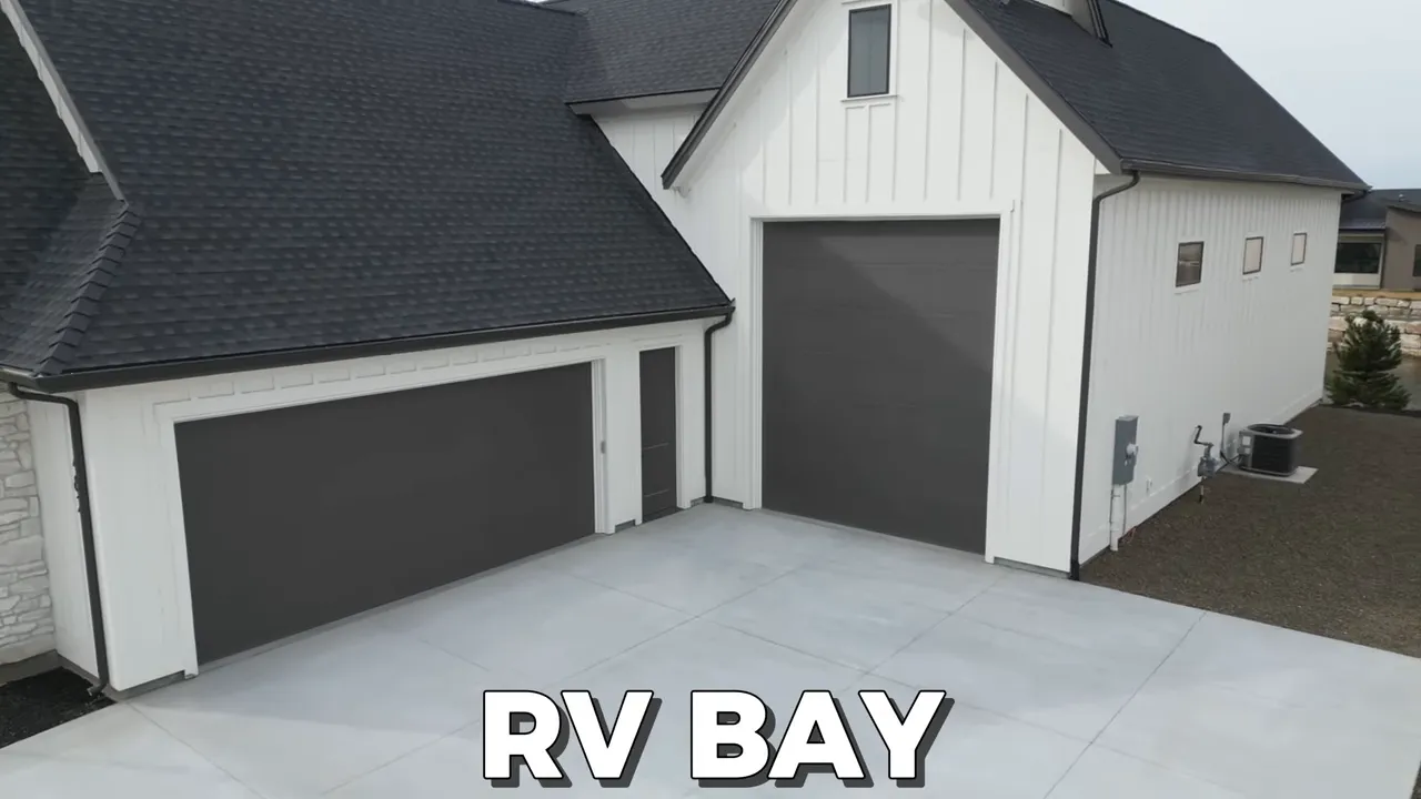 RV bay in a new construction home in Middleton, Idaho with two large garage doors and paved pad