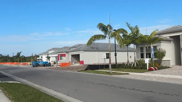 Residential street with finished homes and homes under construction