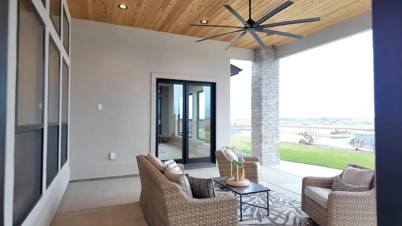 Covered patio with wood ceiling ceiling fan seating and open views
