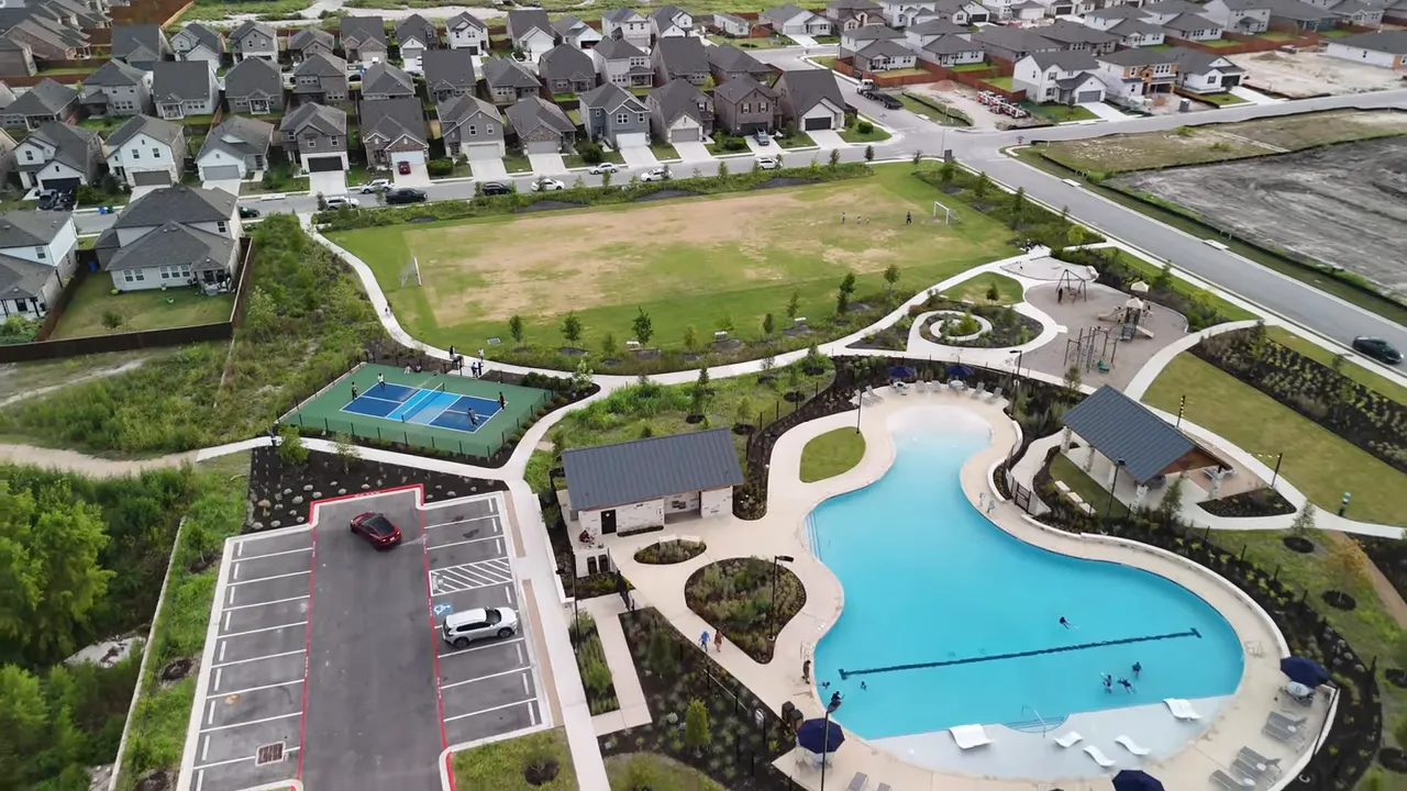 Agents Alisha and Matthew smiling with new homeowners