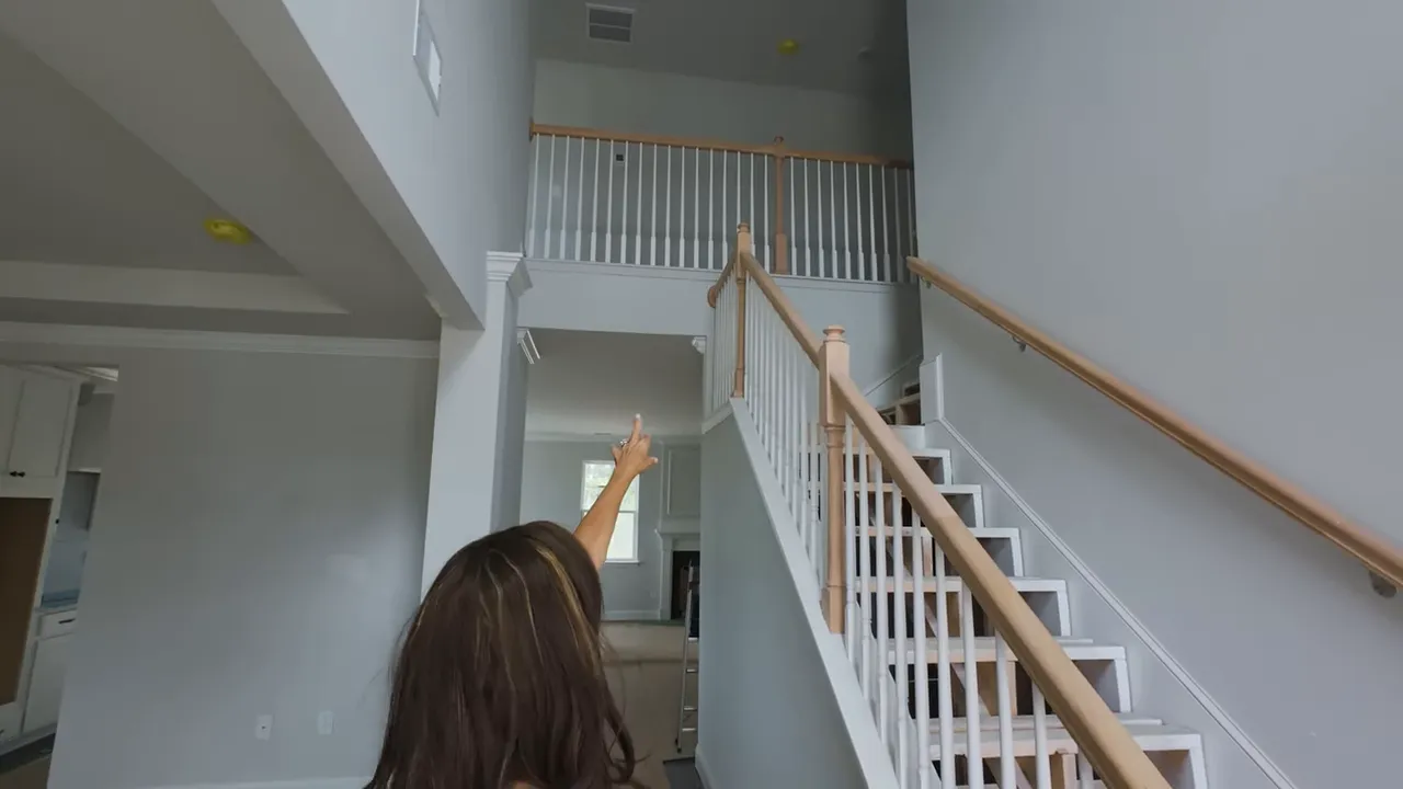 Open two-story staircase and upstairs loft area in a newly built North Myrtle Beach home
