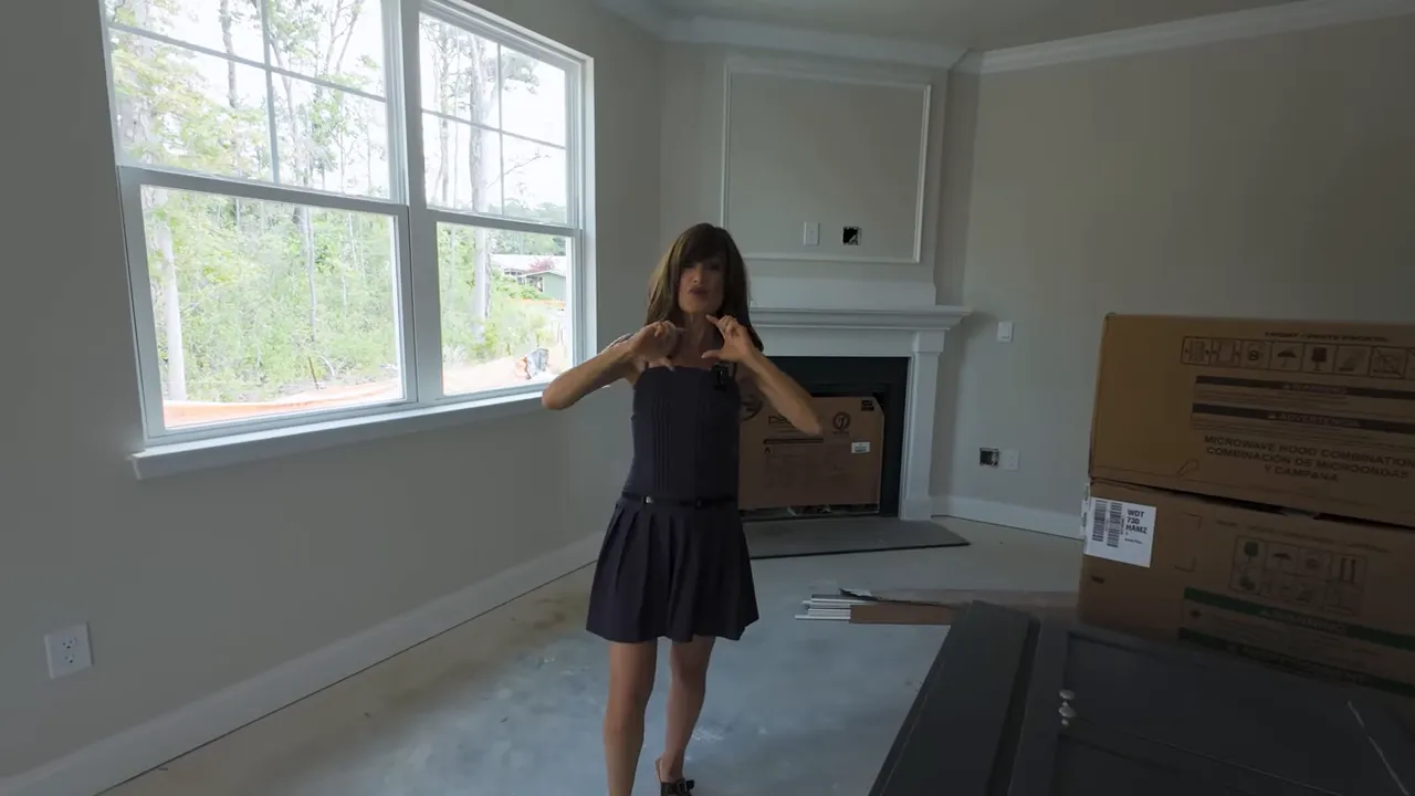 Primary bedroom with multiple window panes and fireplace wall in North Myrtle Beach new construction