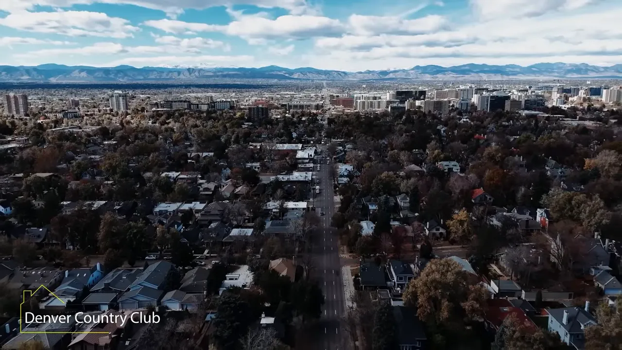 Aerial view showing Denver Country Club neighborhood with downtown skyline in the distance