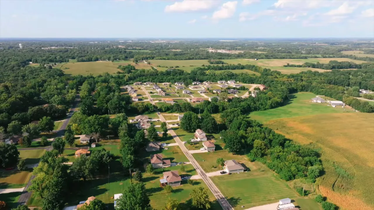 Clear aerial view of Indian Point neighborhood in Warrensburg Missouri showing tree-lined streets and homes