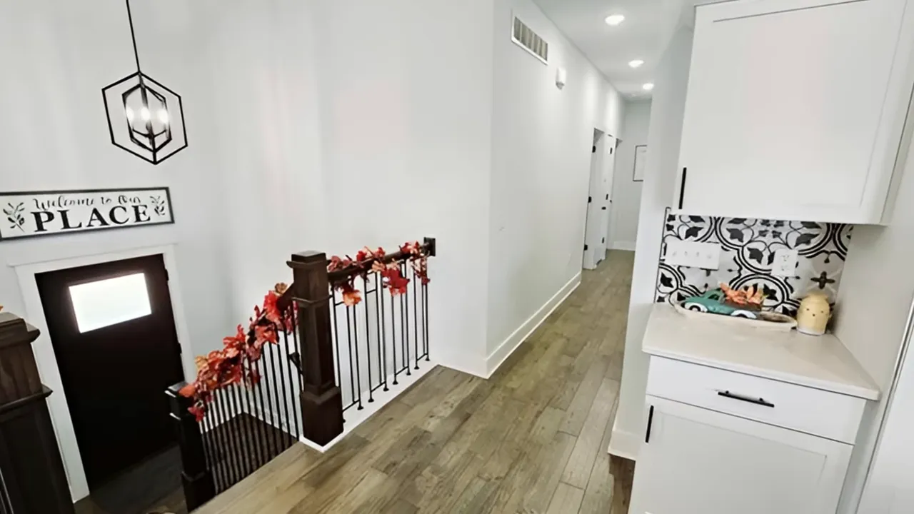 Modern interior hallway with built-in bench and decorative tile in an Indian Point home