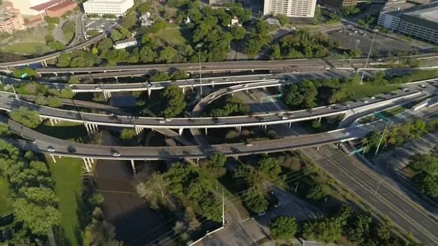 Aerial view of multilayer Houston freeway interchange with traffic