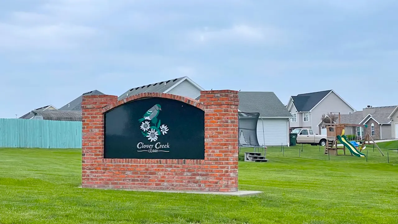 Clover Creek Estates entrance sign and landscaping in Warrensburg, Missouri