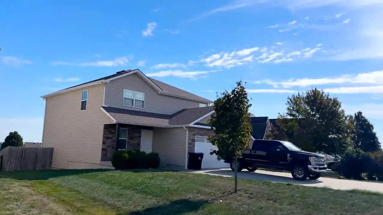 Clover Creek Estates Warrensburg MO two-story home exterior with maintained landscaping