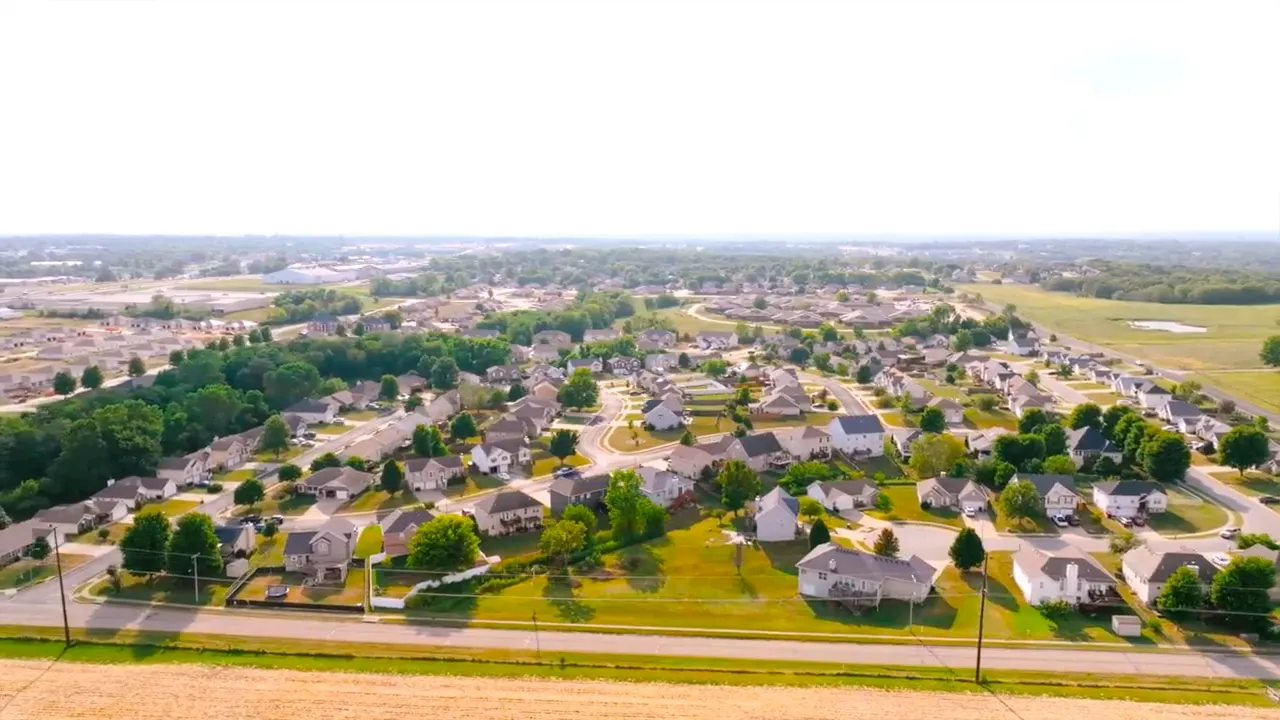 Wide aerial view of Warrensburg Missouri neighborhood streets and homes