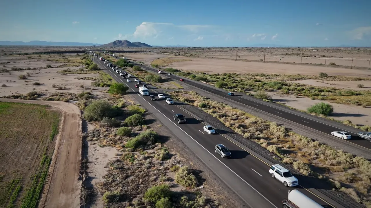 Traffic traveling on a divided highway through the Sonoran Desert