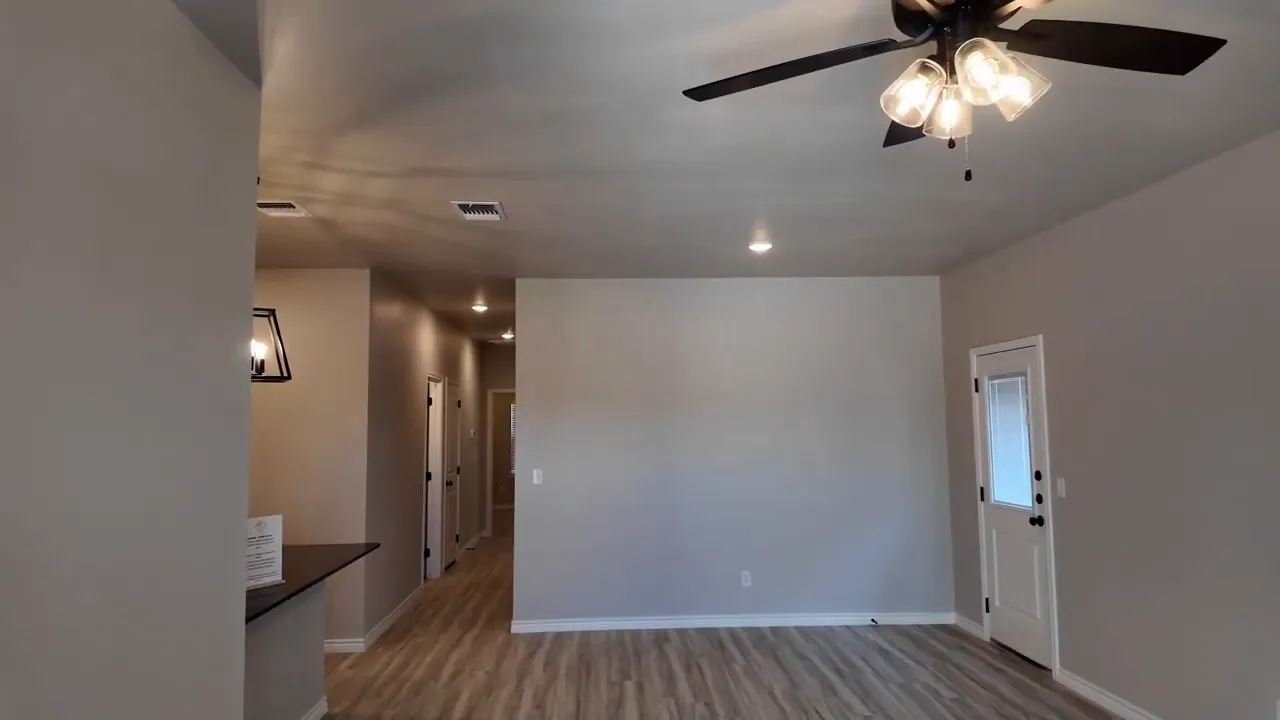 Open living room area inside Heritage Place duplex at 110 Leon Drive with luxury vinyl plank flooring