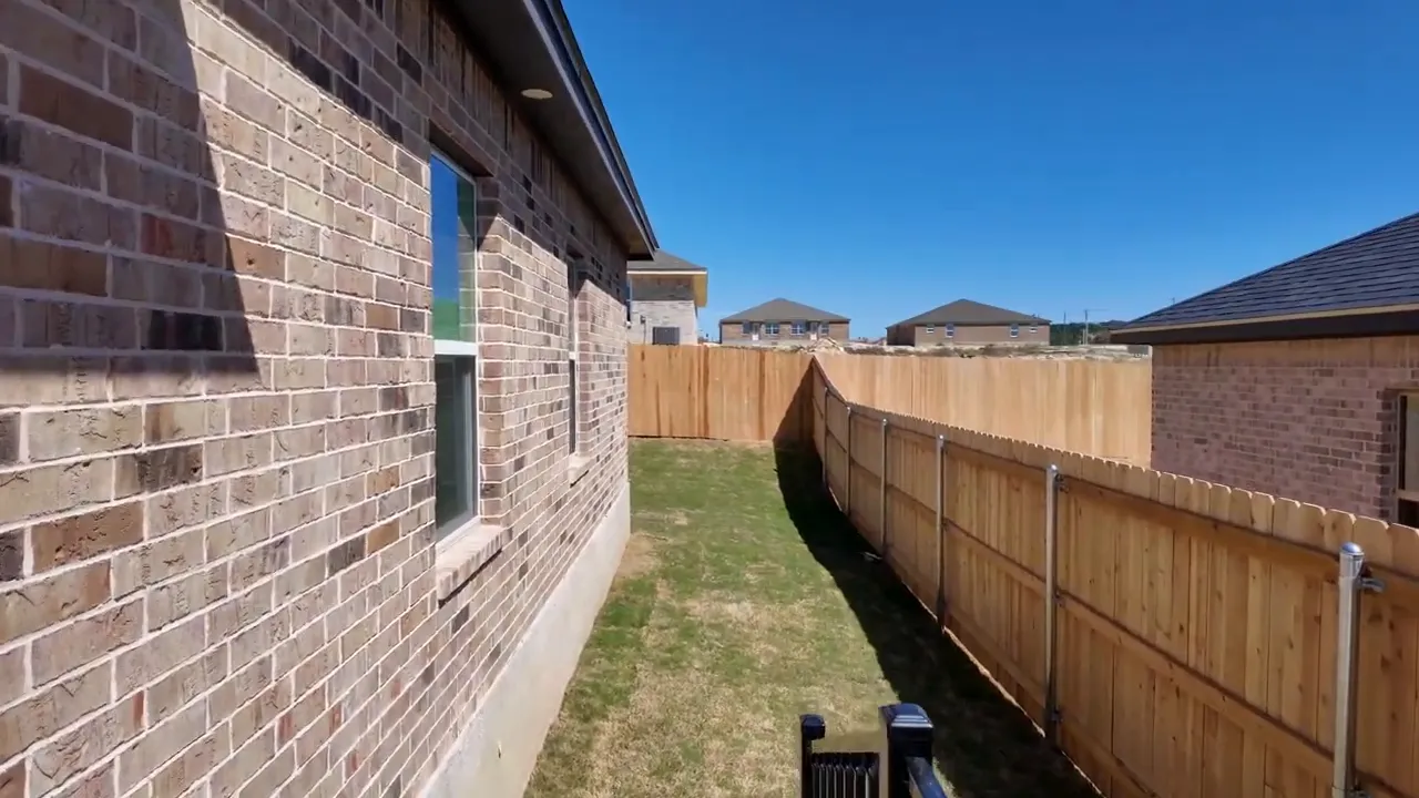 Heritage Place duplex backyard privacy view with side yard fence at 110 Leon Drive Copperas Cove TX