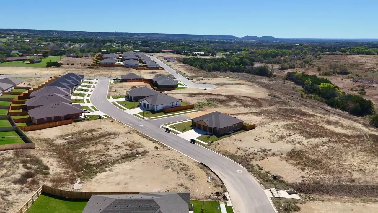 High aerial view of Heritage Place Copperas Cove TX neighborhood road and homes