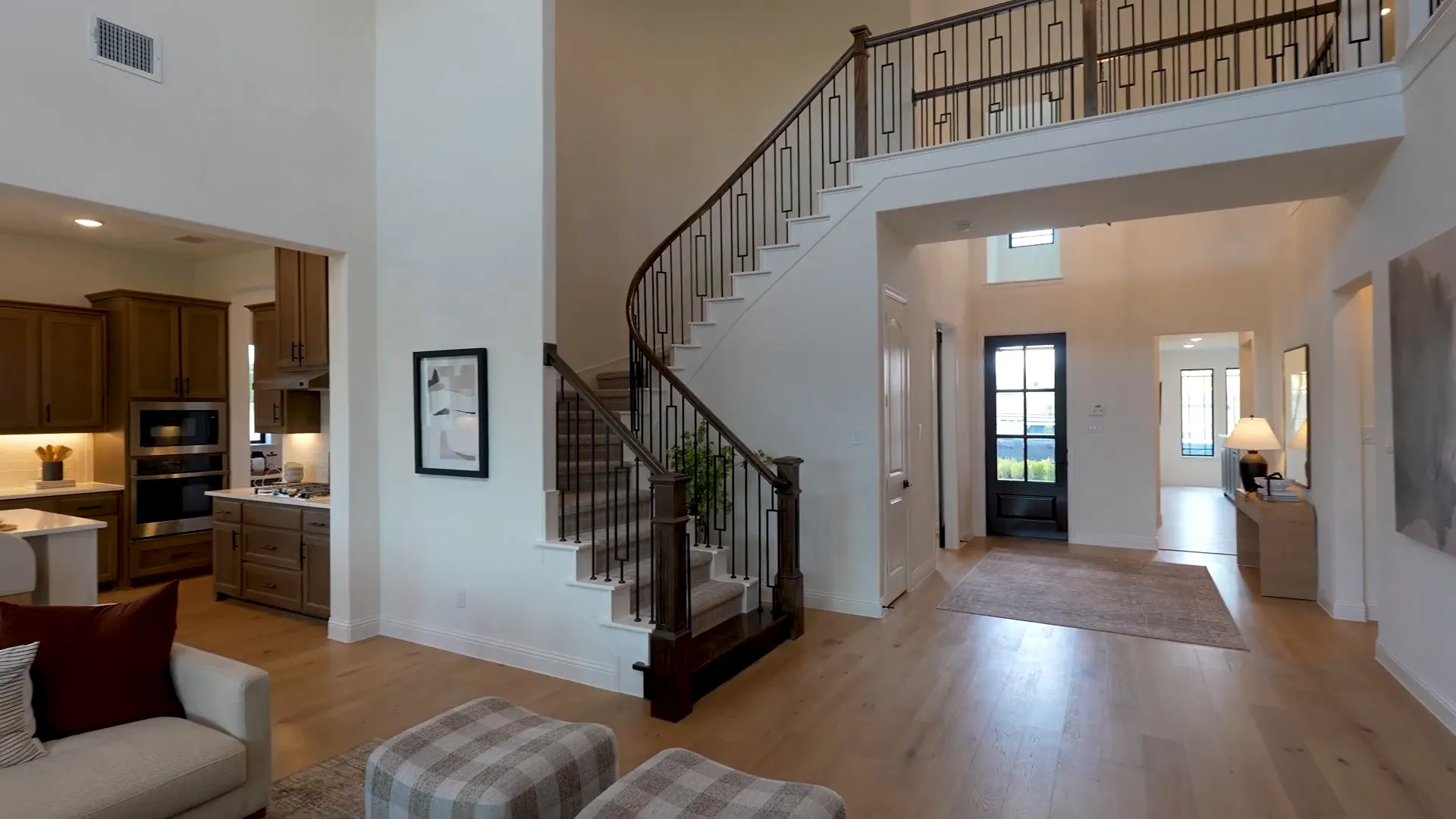 Wraparound staircase with upstairs catwalk view