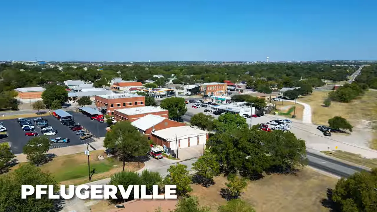 Aerial view of Pflugerville, Texas neighborhood and commercial area