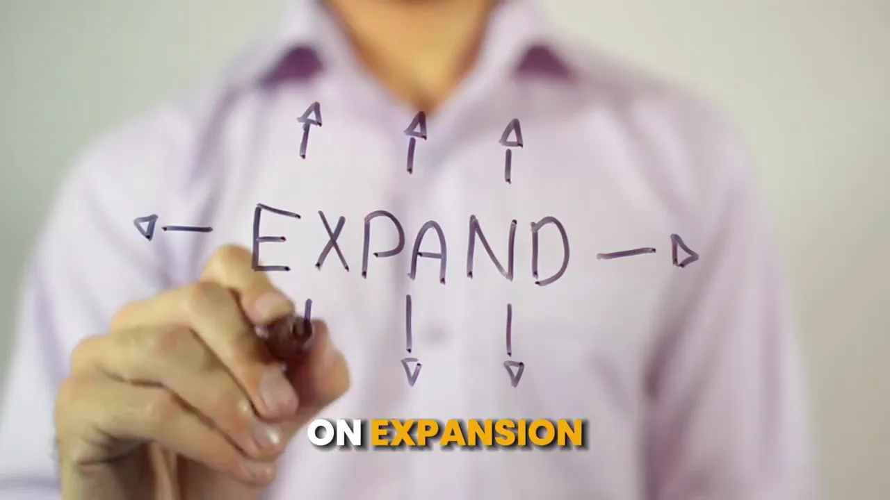 Person writing the word expand with arrows pointing outward
