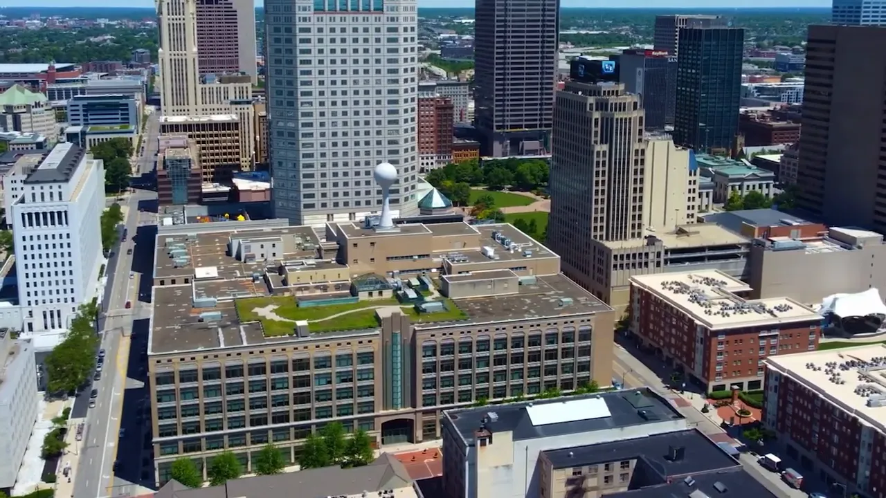 Aerial downtown buildings with text reading rural areas