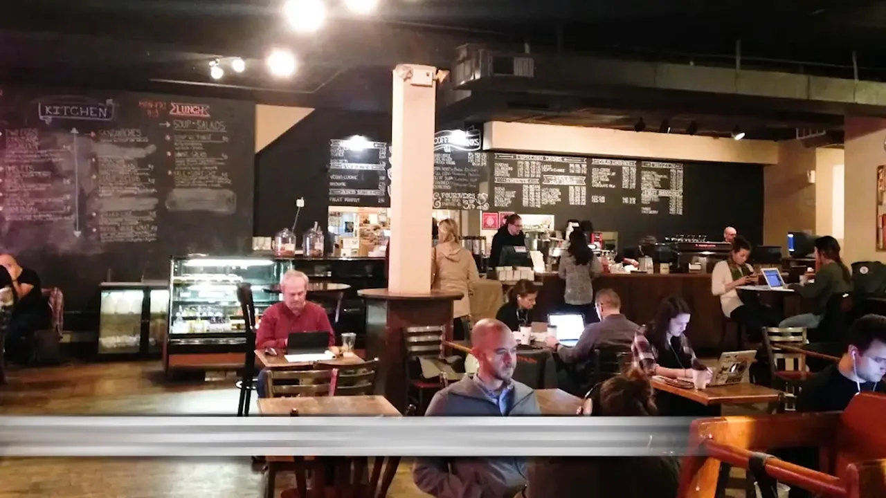 Interior of Staufs Coffee Roasters with customers seated inside