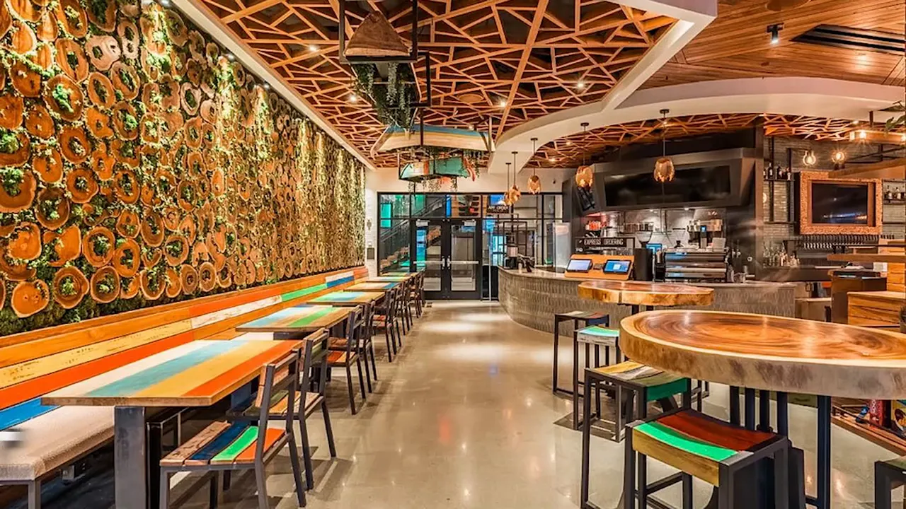 Interior of TownHall restaurant with tables, wall art, and open dining space