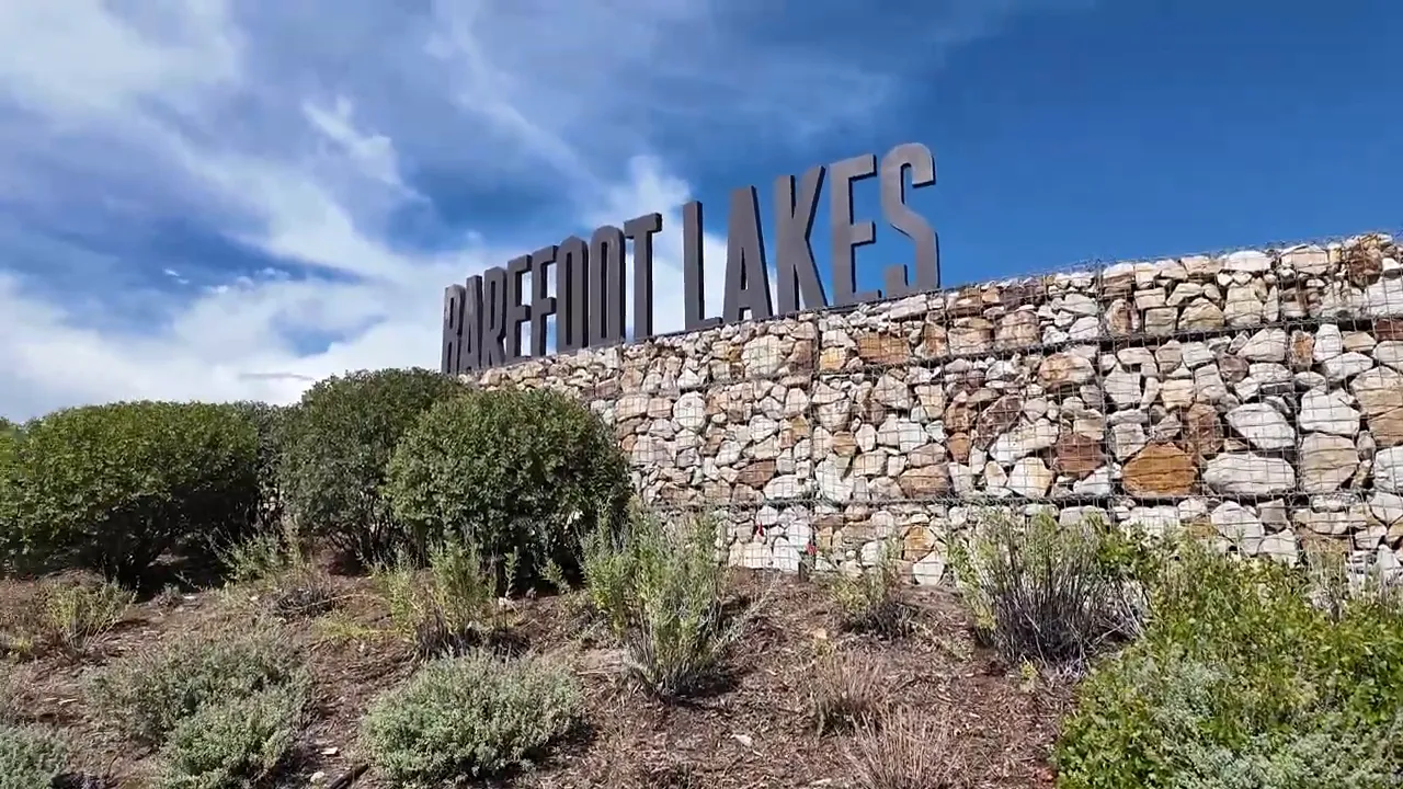 Entrance sign for Barefoot Lakes community