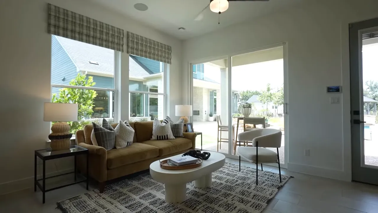 Casita living area with seating large windows and kitchenette