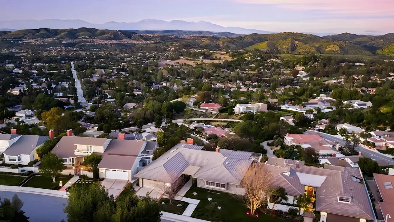 Aerial view of established City of Orange neighborhoods with hills in the distance