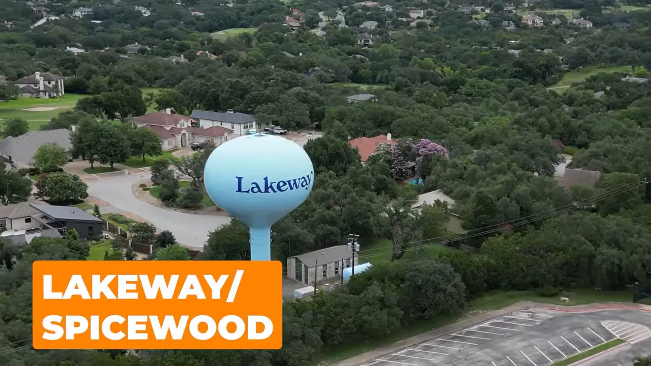 Lakeway water tower surrounded by trees and homes
