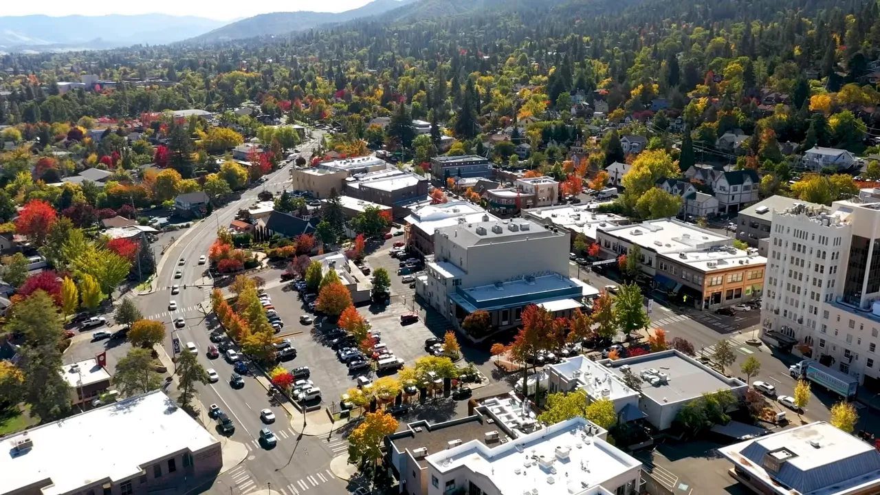 Aerial view of downtown Ashland surrounded by wooded hillsides