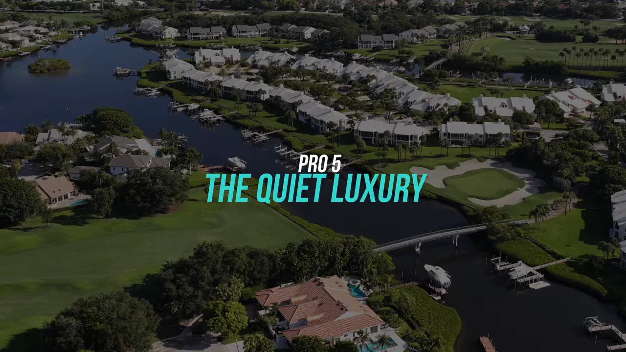 Aerial view of golf course fairways homes and water features