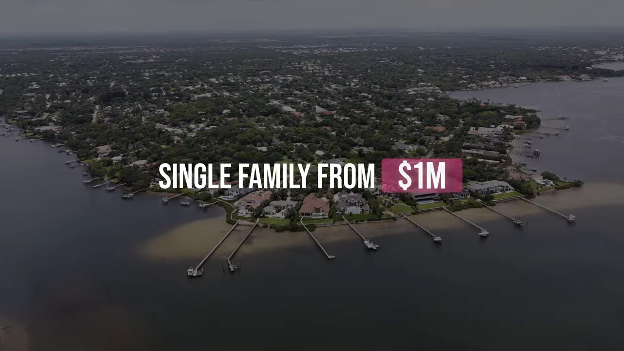 Aerial waterfront neighborhood with text stating single family from one million dollars