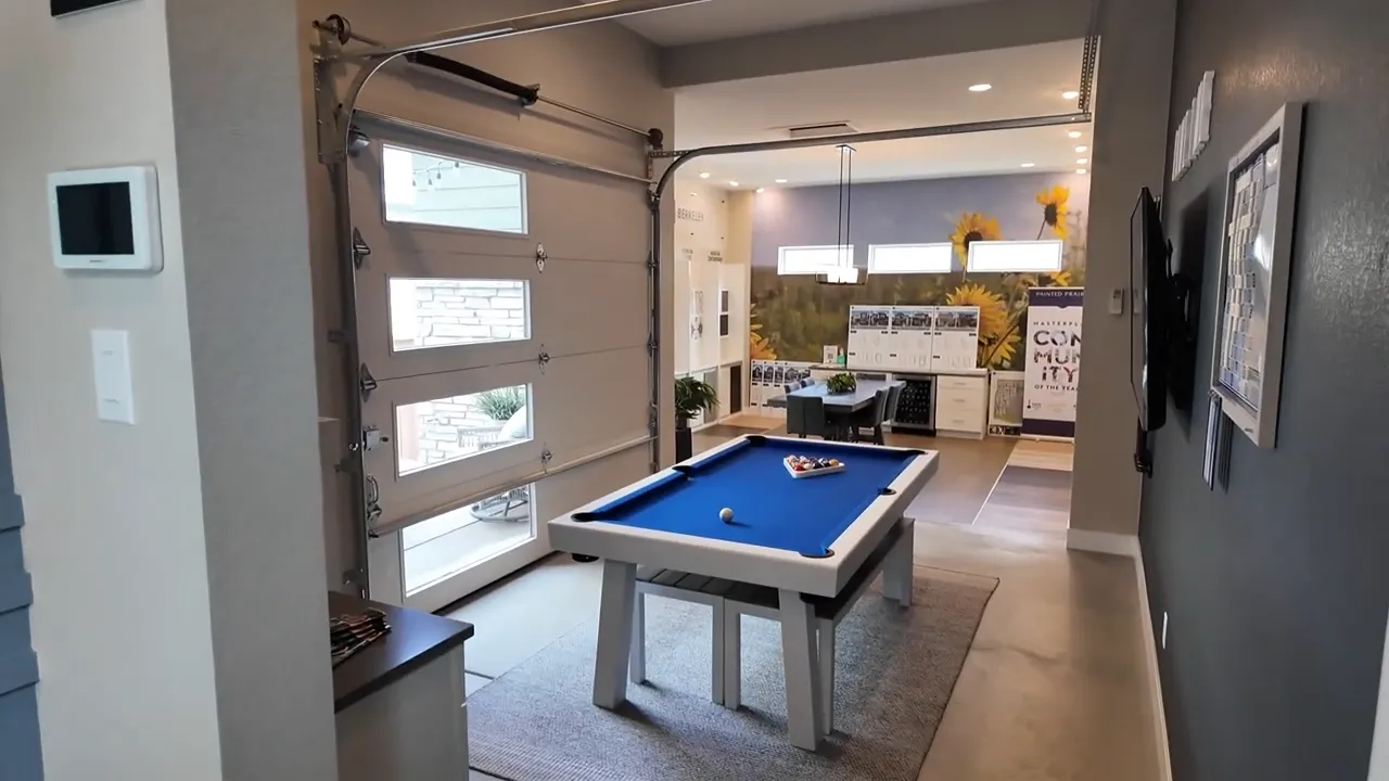 Residence 2 optional rec room off the back with pool table and garage-style door in Painted Prairie model home