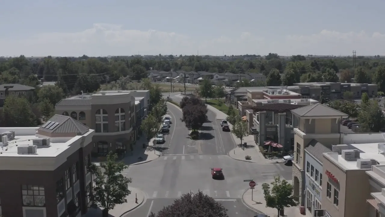 aerial view of a Boise city street lined with low rise buildings and trees