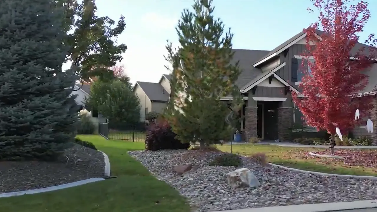 suburban homes with driveways garages and landscaped front yards