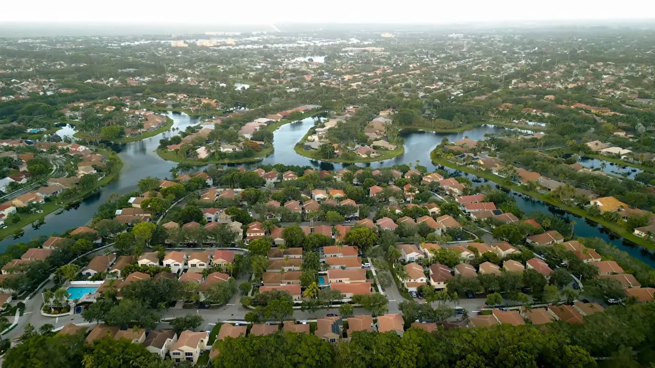 Aerial view of residential neighborhoods and waterways in West Lake Worth FL
