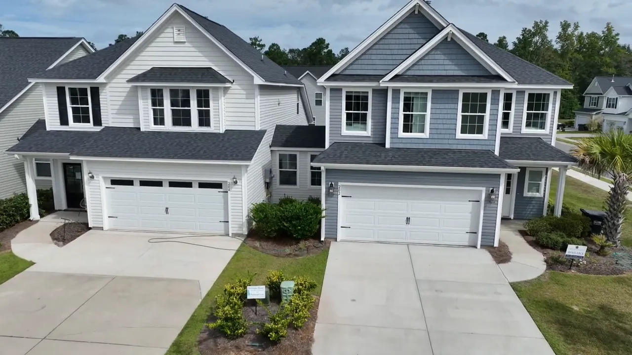 Two new construction homes in Summerville SC with driveways and garage doors