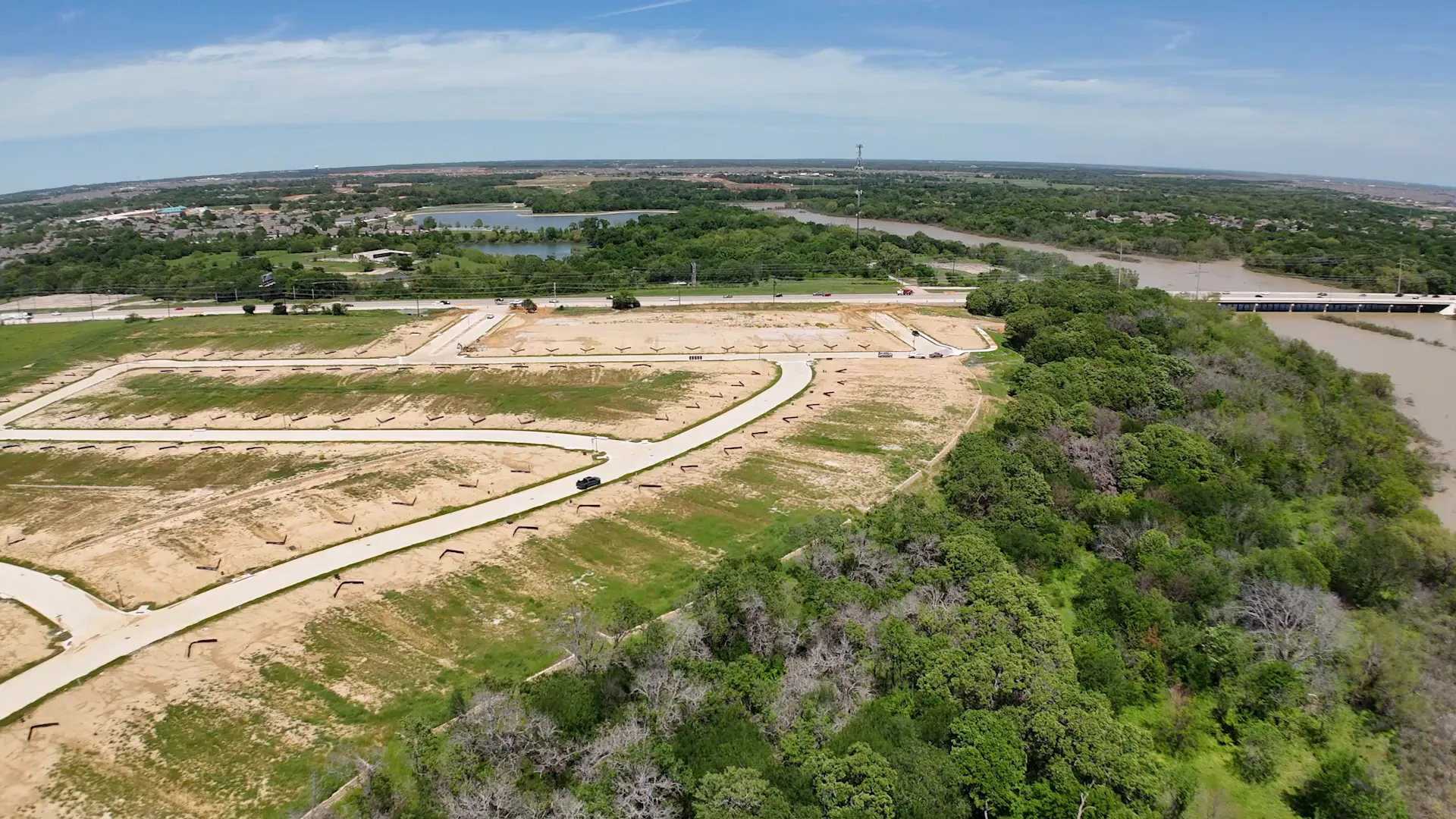 Community street view with new homes under construction at The Reserve at Spiritas Ranch