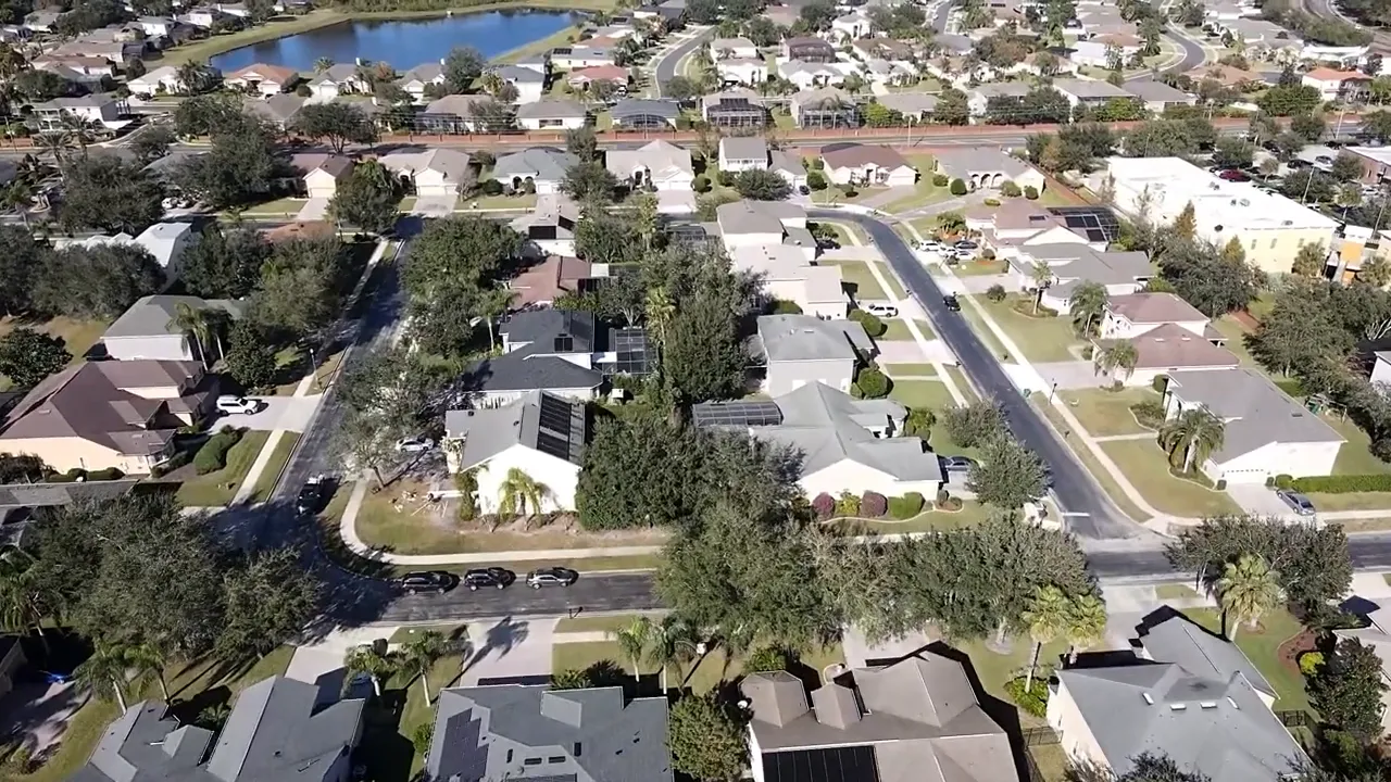 Aerial view of established neighborhood streets and homes in Dacono area
