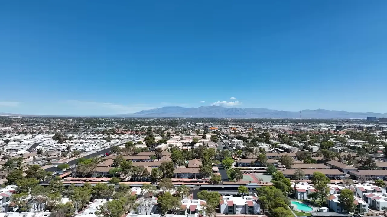 Las Vegas aerial view with a temperature graphic reading 120 degrees Fahrenheit