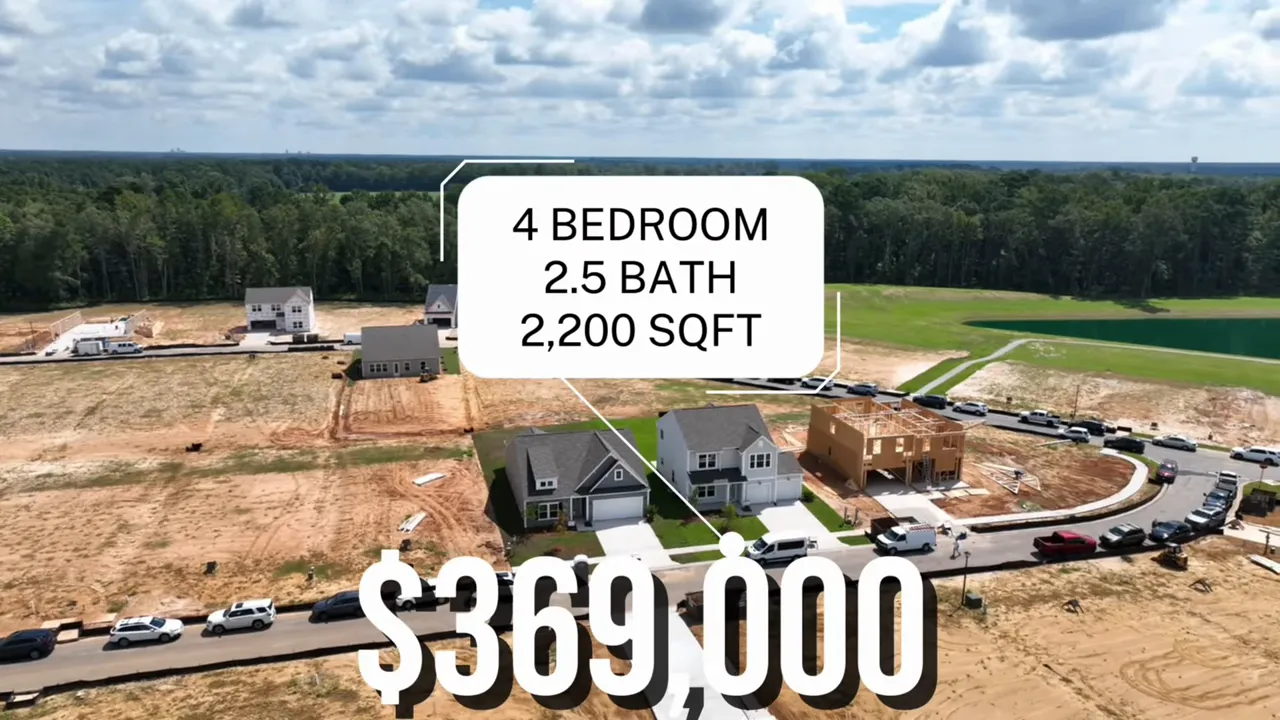 Drone photo of new houses at Reeves Crossing with a callout '4 BEDROOM 2.5 BATH 2,200 SQFT' and an overlaid price of $369,000.