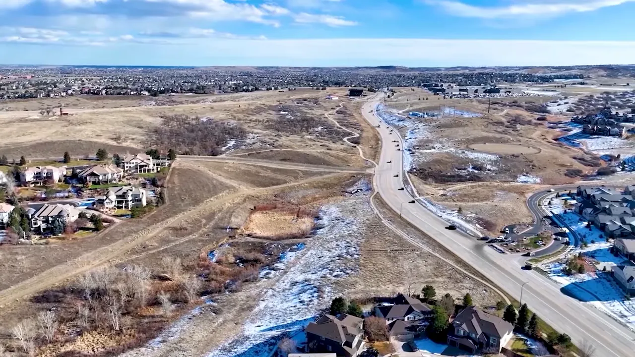 Aerial view of Highlands Ranch open space and residential development with winding roads