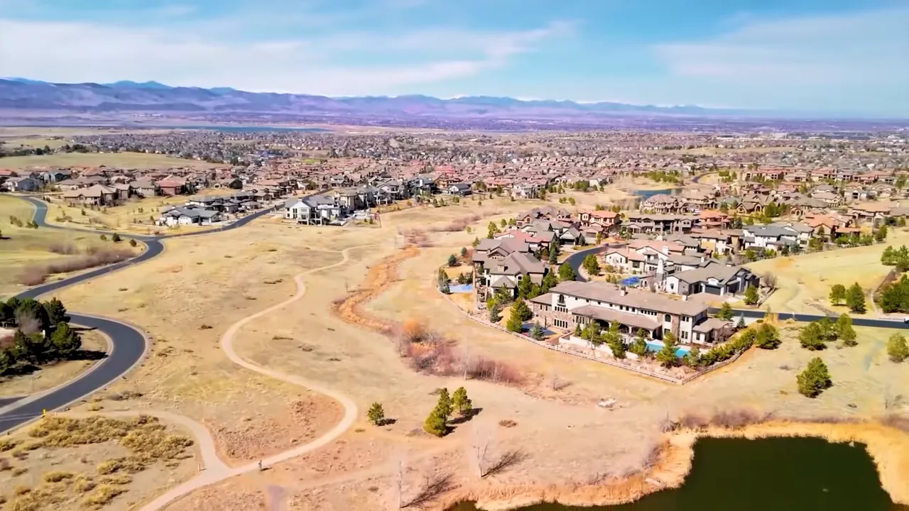 Aerial view of Highlands Ranch Colorado with homes, open space, and winding roads
