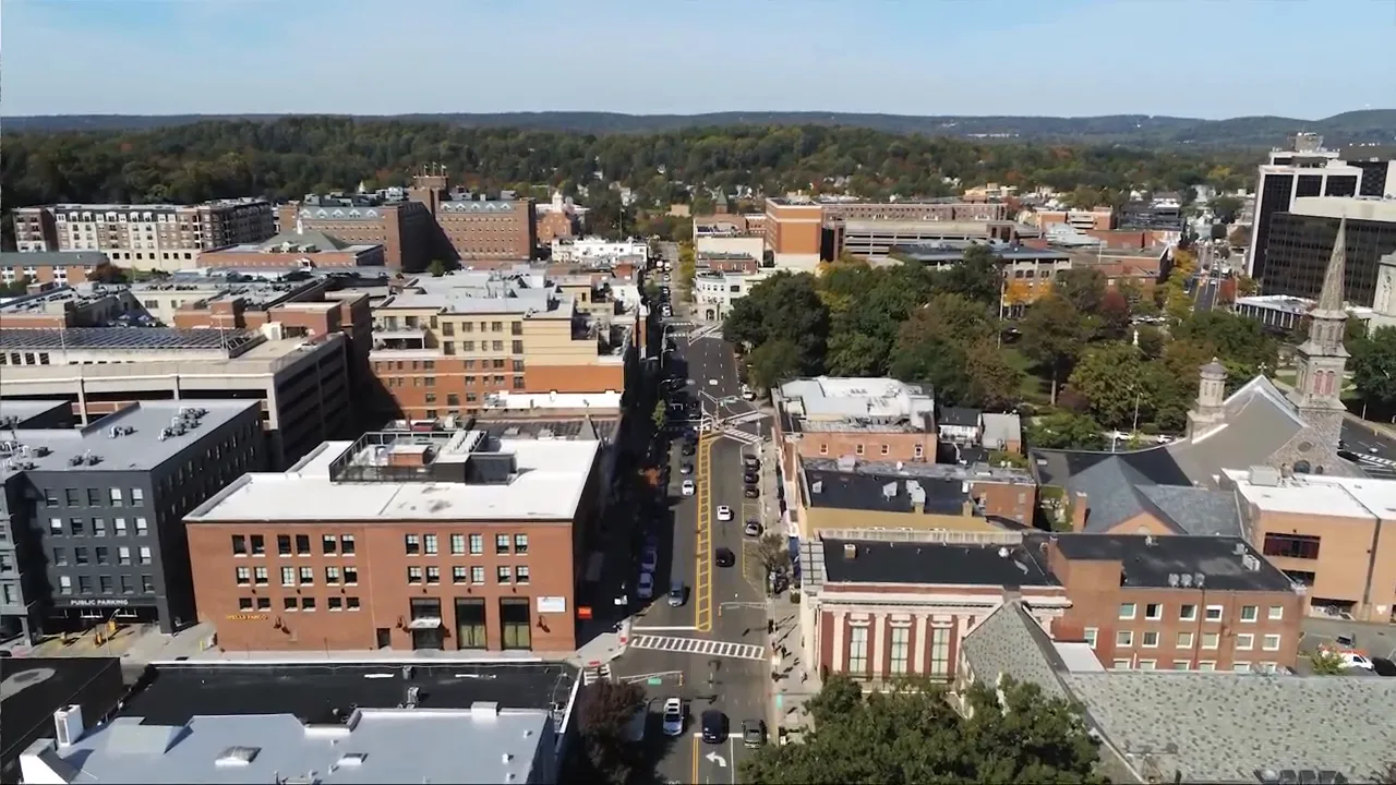 High-resolution aerial photo of Morristown downtown showing streets, buildings and nearby green areas