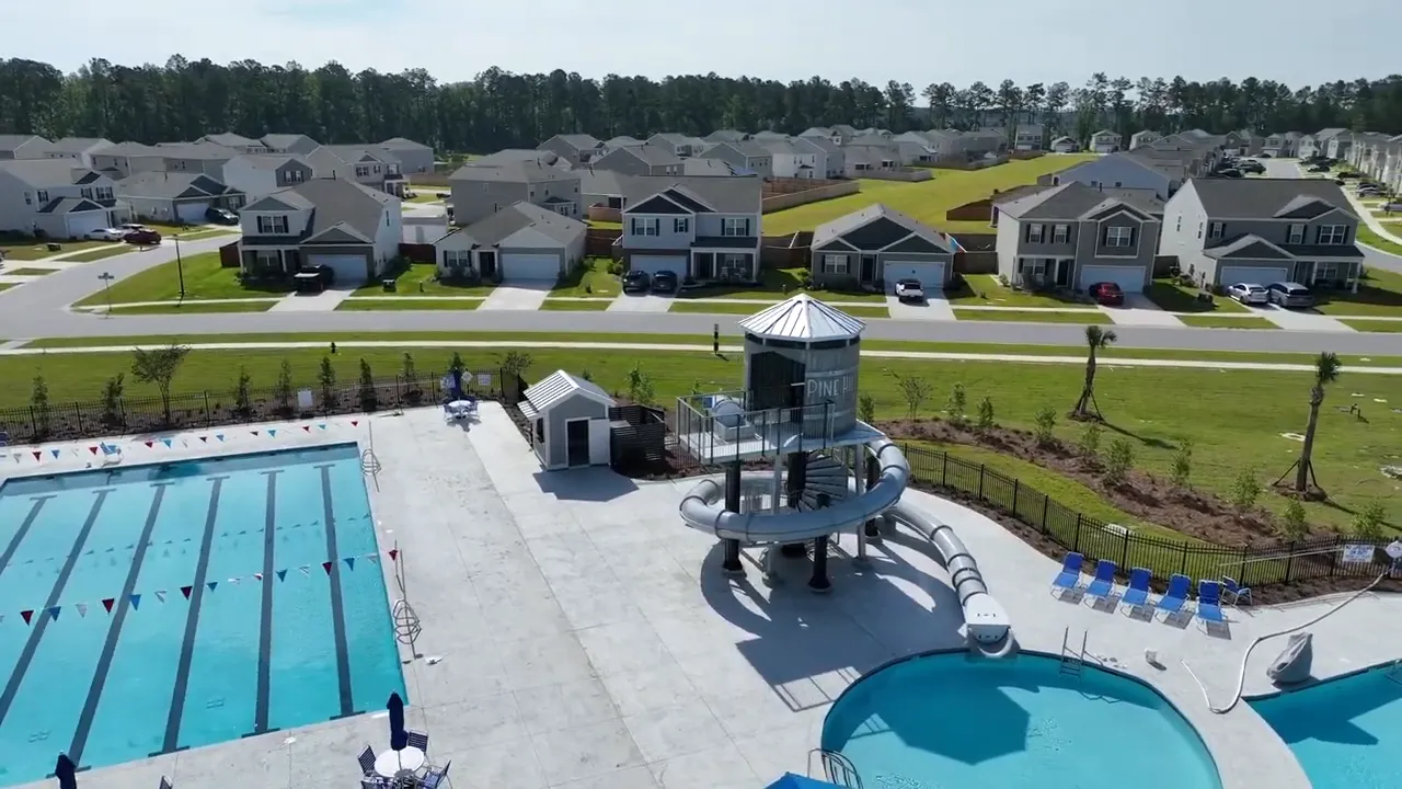 Aerial view of Cane Bay pool area with slide tower and sun loungers
